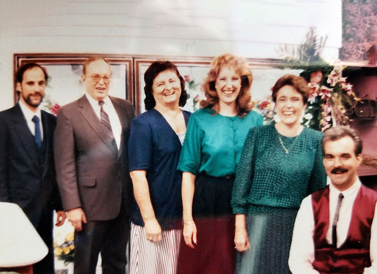 Six members of the Wilson family, posing in-store some time in the late 1980s